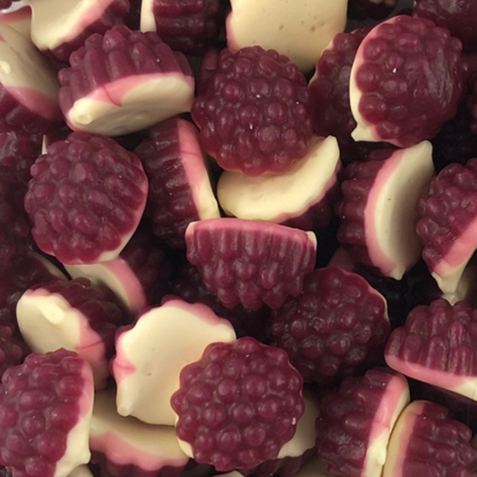 A close-up image of chewy boysenberries-shaped gummy candies with a white and purple color scheme.