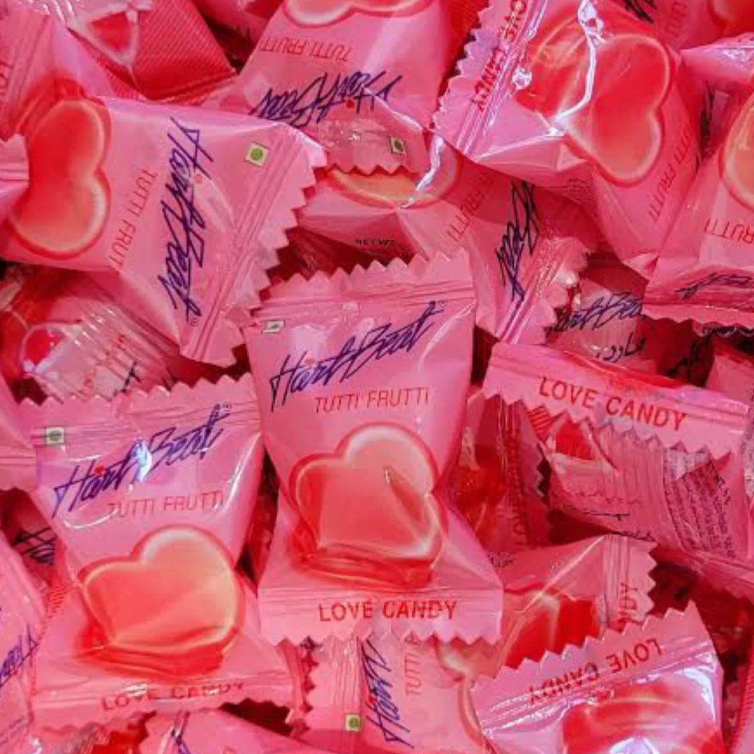 Pile of pink 'Tutti Frutti' heart-shaped candy packages.