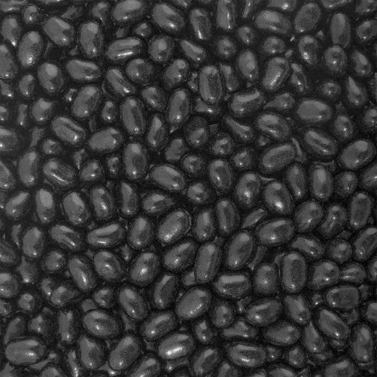 Close-up of black jelly beans beans with a textured surface