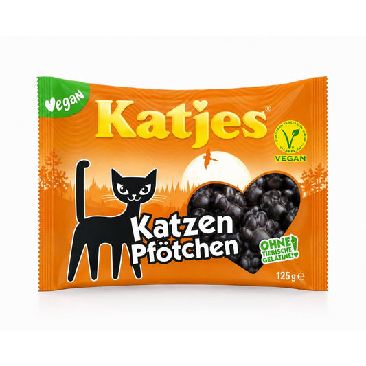 A package of Katjes vegan cat gummy treats, featuring an orange wrapper with a black cat illustration, a heart-shaped window showing dark gummies, and a green vegan badge.