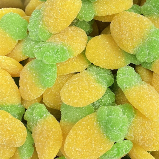 Close-up of yellow and green gummy candies pineapples