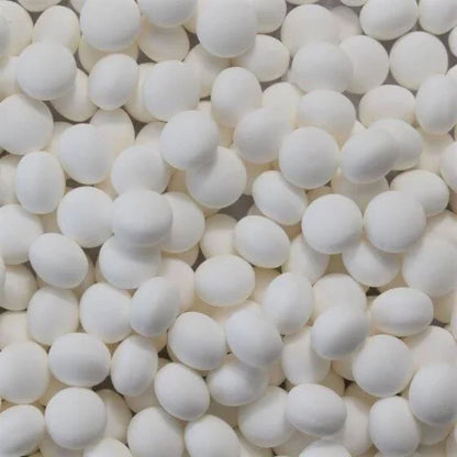 Close-up of numerous white spherical  perppermint lollies