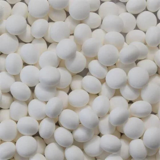 Close-up of numerous white spherical  perppermint lollies