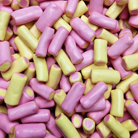 close up of pink & yellow candy with a fondant centre