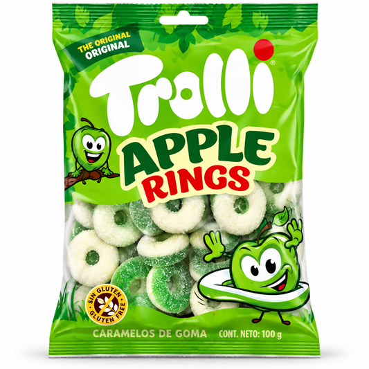 A 100g bag of Trolli Apple Rings caramels, featuring a bright green packaging design with the brand name 'Trolli' in large white letters and 'APPLE RINGS' in green and red. The clear window on the bag shows the green and white sugar-coated ring-shaped caramels inside.