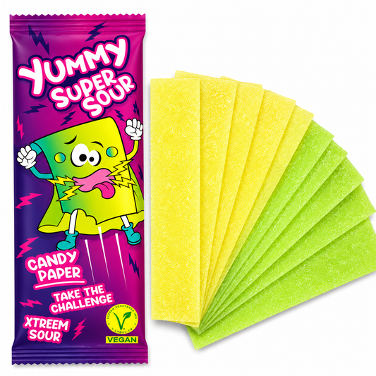 A packaged candy paper product shown on a white background, with a single wrapped strip on the left and several unwrapped translucent yellow-green candy sheets fanned out on the right. The packaging reads 'Yummy Super Sour' and includes cartoon graphics and flavor text.