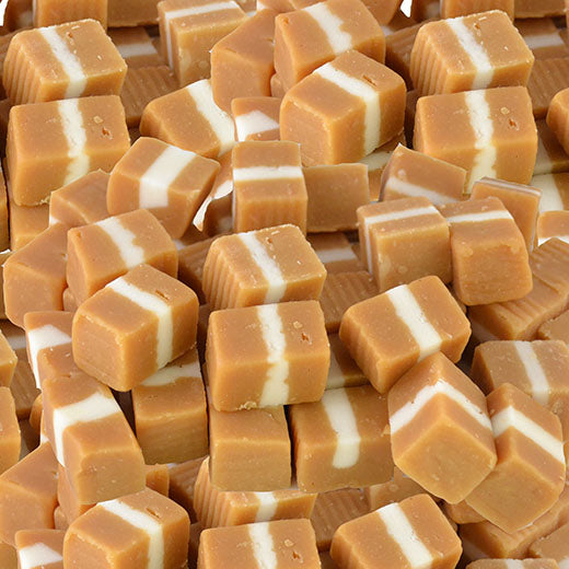 closeup of brown & white layered caramel fudge sweets